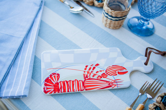 Ceramic trivet with lobster print on coastal blue table accents