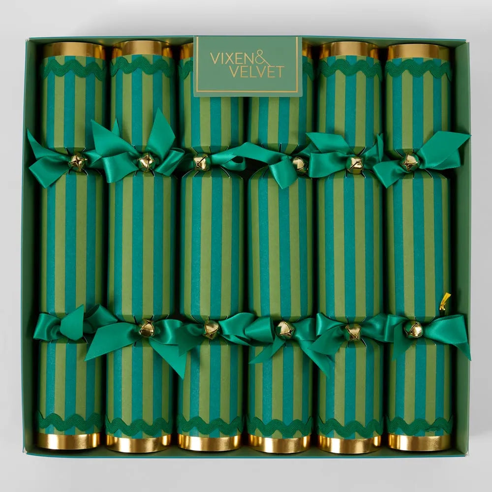 Box of green striped crackers with gold ends and green bows, branded 'Vixen & Velvet'.